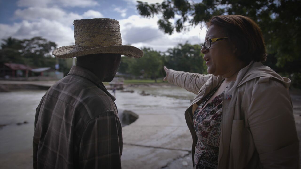Gladys Felix-Pimentel with a Haitian male at Massacre River.